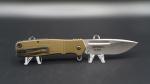 Product Description: The Homefront flipper is the first in the CRKT fleet to feature the patent pending "Field Strip" technology. This in-field, no-tool take apart capability lets you purge your most reliable companion of a hard day's grime right where you are, without ever returning to your workbench.</br></br>The breakthrough Field Strip innovation comes from the shop of world-renowned knife craftsman Ken Onion and has been over ten years in the making. To disassemble the Homefront when the knife is in the closed position, push the front release lever away from the blade, then spin the turn release wheel on the rear of the handle away from the pivot shaft--once you feel the handle release, pull it up and away from the blade. Reassembly is as easy as reversing the procedure, allowing for practical, quick maintenance where you stand.</br></br>Overall Length:</br>8.312 in.</br></br>Blade Length:</br>3.50 in.</br></br>Blade Thickness:</br>0.13 in.</br></br>Blade Material:</br>AUS-8 Stainless Steel</br></br>Hardness:</br>58-60 HRC</br></br>Blade Style:</br>Drop Point</br></br>Blade Grind:</br>Hollow Ground</br></br>Blade Finish:</br>Satin</br></br>Edge Type:</br>PlainEdge</br></br>Handle Length:</br>4.75 in.</br></br>Handle Thickness:</br>0.51 in.</br></br>Handle Material:</br>6061 Aluminum</br></br>Handle Color:</br>Bronze</br></br>Frame/Liner:</br>Stainless Steel</br></br>Weight:</br>4.80 oz.</br></br>Pocket Clip:</br>1 Position Right Hand Tip-Up</br></br>Knife Type:</br>Manual Opening Folder</br></br>Opener:</br>Flipper</br></br>Lock Type:</br>Liner Lock</br></br>Brand:</br>CRKT</br></br>Model:</br>Homefront</br></br>Model Number:</br>K270GKP</br></br>Designer:</br>Ken Onion</br> CRKT K270GKP HOMEFRONT